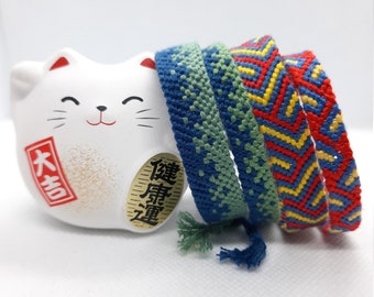 pair of DMC Brazilian bracelets, 8 and 12 strands