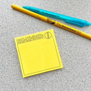 May include: A square yellow sticky note with a black border, the word REMINDER, and an exclamation point icon. A yellow pencil with the text The Intentional IEP and a translucent teal pen with the text The Intentional IEP are placed above.