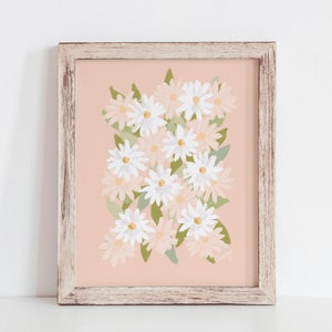 May include: A framed print with a pink background and a cluster of white and light pink daisies with green leaves. The print is signed "Curvy".