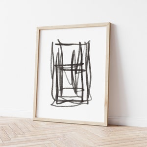 May include: A black and white abstract drawing in a wooden frame. The drawing features a series of intersecting lines and shapes.