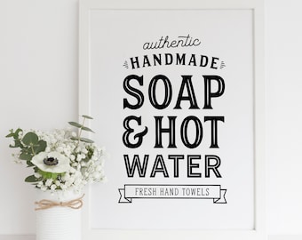 May include: Black and white printable sign with the text "authentic handmade soap & hot water fresh hand towels".