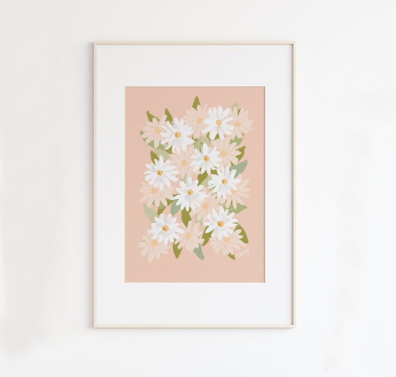May include: A framed print of a floral illustration featuring white and pink daisies on a peach background.