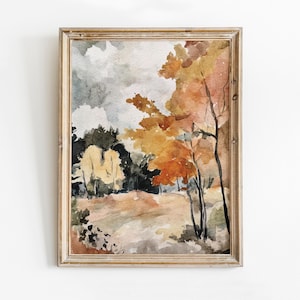 May include: Watercolor painting of a landscape with trees in autumn colors. The artwork features a wooden frame and a serene scene with shades of orange, yellow, and green. The sky is a mix of gray and white.