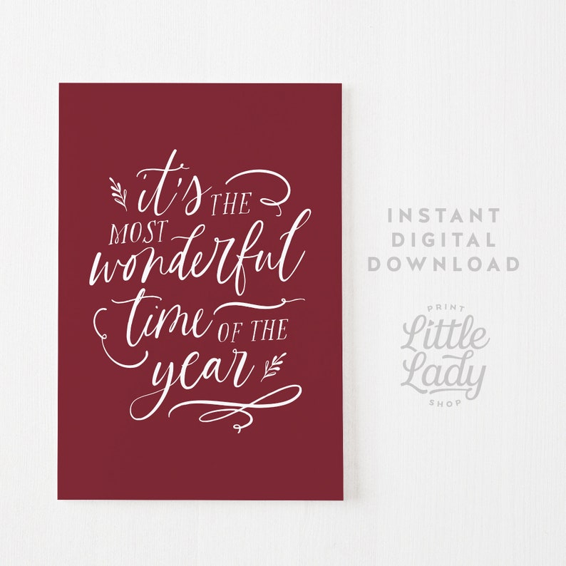 May include: A burgundy printable art print with white text that reads "It's the most wonderful time of the year".