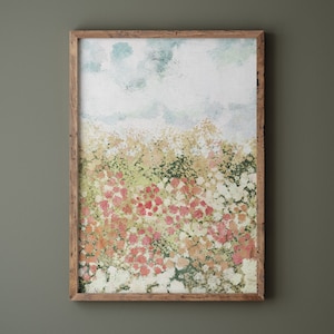 May include: A framed watercolor painting of a field of flowers in shades of pink, white, and green. The sky is a light blue with white clouds.