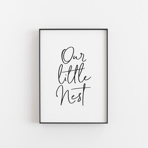 May include: Black and white printable wall art with the text "Our little nest" in a cursive font.