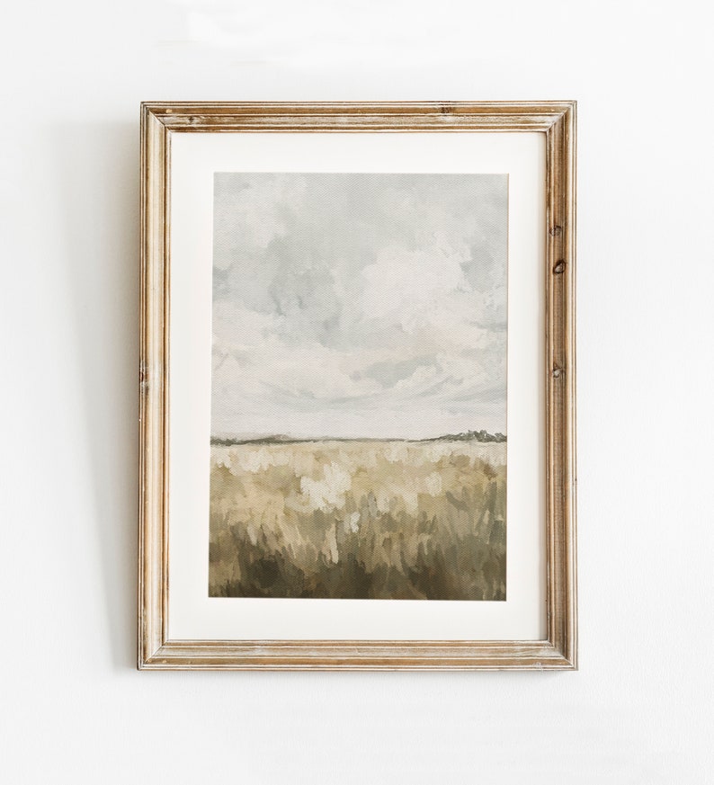May include: A framed painting of a landscape with a field of tall grass in shades of brown and green under a cloudy sky.