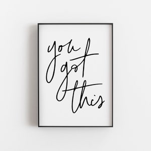 Peut inclure: Impression typographique en noir et blanc avec le texte "you got this" dans un style manuscrit. L'impression est encadr&eacute;e dans un cadre noir.