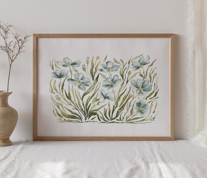 May include: A framed watercolor painting of a cluster of blue flowers with green leaves and stems on a white background.