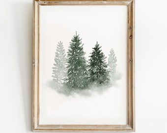 May include: A framed watercolor painting of three green pine trees in a snowy forest. The trees are painted in a soft, muted green, and the snow is depicted as a light, airy mist.