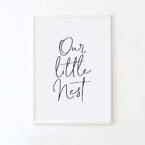 May include: Black and white printable wall art with the text "Our little nest" in a cursive font.