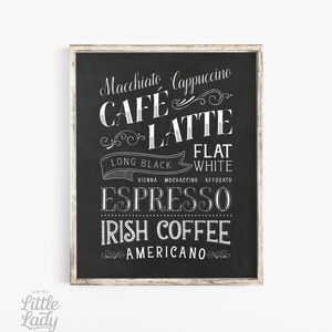 May include: Black and white chalkboard sign with a list of coffee drinks, including: Macchiato, Cappuccino, Cafe Latte, Long Black, Flat White, Vienna, Mochaccino, Affogato, Espresso, Irish Coffee, and Americano.