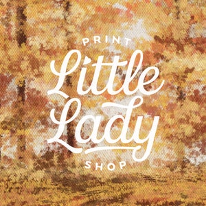 May include: A watercolor painting of a forest in autumn colors with the text "PRINT little Lady SHOP" in white.