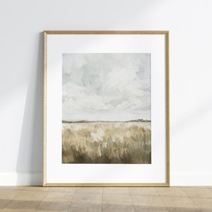 May include: A framed abstract landscape painting with a light blue sky and white clouds over a field of brown and green brushstrokes.