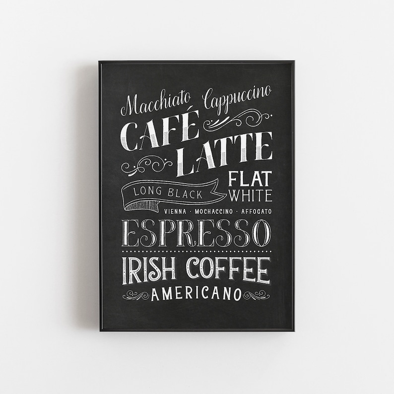 May include: Black and white chalkboard sign with a list of coffee drinks, including Macchiato, Cappuccino, Cafe Latte, Long Black, Flat White, Vienna, Mochaccino, Affogato, Espresso, Irish Coffee, and Americano.