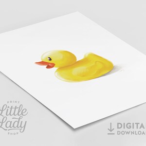 May include: A yellow rubber duck with a red beak and eyes. The duck is sitting on a white background.