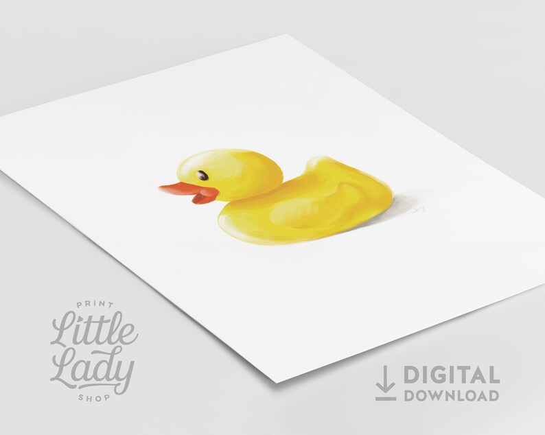 May include: A yellow rubber duck with a red beak and eyes. The duck is sitting on a white background.
