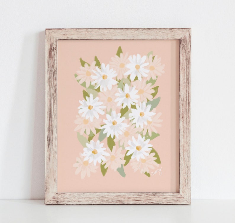 May include: A framed print with a pink background and a cluster of white and light pink daisies with green leaves. The print is signed "Curvy".