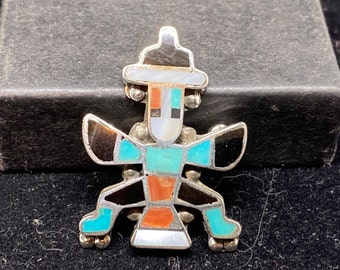 Broche con forma de ala de cuchillo en plata de ley con incrustaciones de canal de ónix, coral rojo, nácar y turquesa