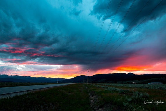 Storm and Sunset over road in Yellowstone Montana