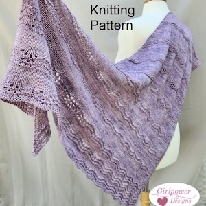 May include: A purple knitted shawl with a lacy pattern and a wavy edge. The shawl is draped over a dress form. The text "Knitting Pattern" is written above the shawl. The text "Girlpower Designs" is written below the shawl.