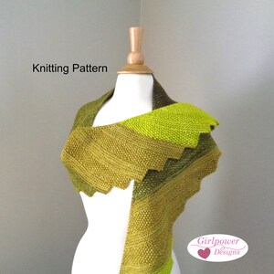 May include: A green knitted shawl on a mannequin. The shawl has a scalloped edge and a gradient colour scheme, shifting from olive to a bright lime green. The text "Knitting Pattern" is visible. The shawl is likely made from wool.