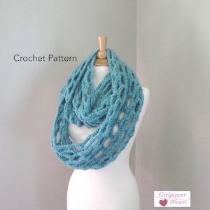 May include: A turquoise crochet infinity scarf displayed on a mannequin. The scarf has an open, lattice-like design. The words "Crochet Pattern" are visible on the left side of the image.