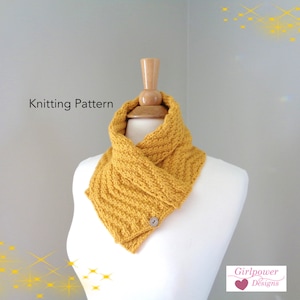 May include: A mustard yellow knitted cowl neck scarf with a button closure. The scarf is displayed on a white mannequin. The text "Knitting Pattern" is visible at the top of the image. The text "Girlpower Designs" is visible at the bottom of the image.