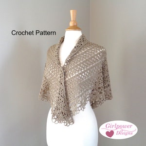 May include: A crocheted shawl in a light brown color, displayed on a white mannequin. The shawl has a delicate lace pattern and a scalloped edge. The text "Crochet Pattern" is visible at the top of the image. The text "Girlpower Designs" is visible at the bottom of the image.