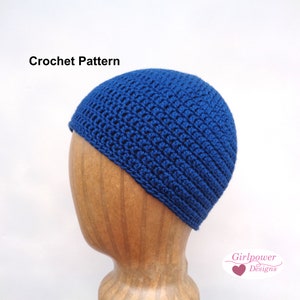 May include: A deep blue crocheted beanie hat displayed on a wooden head form. The hat features a textured stitch pattern and a close fit. The words "Crochet Pattern" are visible in the image.