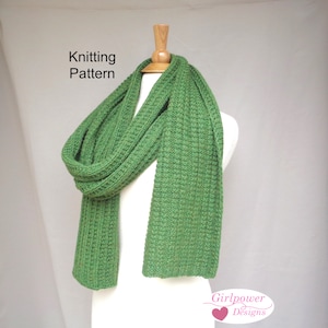 May include: A green knitted scarf with a waffle stitch pattern. The scarf is draped over a white mannequin. The text "Knitting Pattern" is visible in the top left corner of the image. The text "Girlpower Designs" is visible in the bottom right corner of the image.