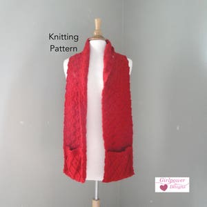 May include: Red knitted scarf with pockets, displayed on a mannequin. The scarf is made with a textured stitch and has a simple, classic design. The text "Knitting Pattern" is visible at the top of the image. The text "Girlpower Designs" is visible at the bottom of the image.