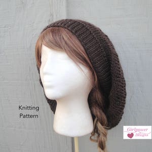 May include: A brown knitted beanie with a slouchy fit. The beanie is made with a simple stitch pattern and has a relaxed, casual look.