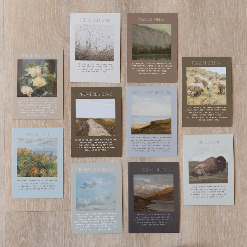 May include: A collection of rectangular cards with various landscape and nature-themed illustrations. Each card features a different Bible verse in a serif font. The color palette includes muted tones of beige, blue, and brown.