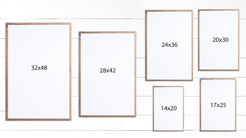 May include: Six different sized picture frames with white mats and wood frames. The frames are arranged in a row on a white wood background. The dimensions of each frame are written on the mat: 32x48, 28x42, 24x36, 20x30, 17x25, and 14x20.