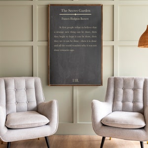 May include: A black chalkboard with a white wooden frame, featuring a quote from "The Secret Garden" by Frances Hodgson Burnett. The quote reads: "At first people refuse to believe that a strange new thing can be done, then they begin to hope it can be done, then they see it can be done - then it is done and all the world wonders why it was not done centuries ago." The number 118 is written at the bottom of the chalkboard.