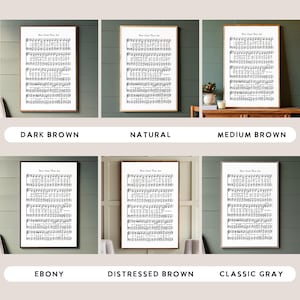 May include: Six different framed prints of sheet music with the title "How Great Thou Art" displayed on a wall with different colored frames. The frame colors are dark brown, natural, medium brown, ebony, distressed brown, and classic gray.