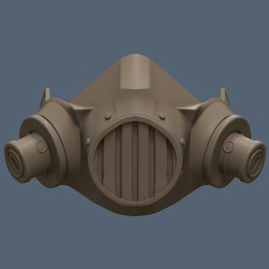 May include: A brown, plastic gas mask with two round, cylindrical air filters on the sides. The mask has a metal grate over the mouth and nose area.