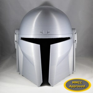 May include: A gray 3D printed helmet with a black visor and the text "MMCC Approved" in a yellow circle.