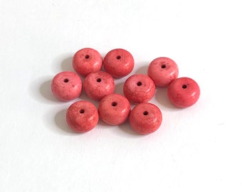 10 perles rose en howlite 10X6 mm.