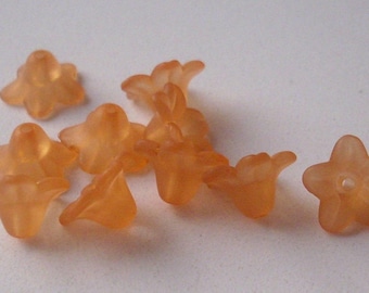 100 orange 10 mm lucite beads.