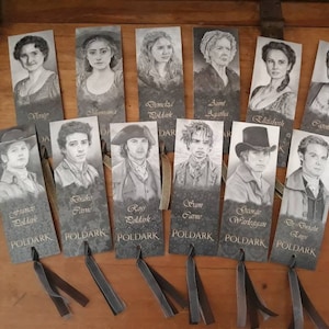 May include: A set of ten black and white bookmark illustrations featuring characters from the Poldark series. The bookmarks are printed with the character's name and the title "Poldark".