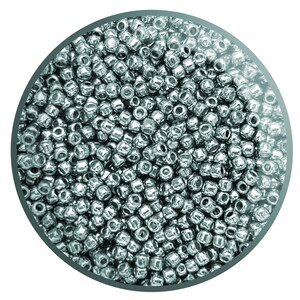 May include: A close-up of a large quantity of silver-coloured seed beads. The beads are round and have a smooth, shiny finish.