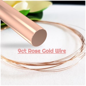 May include: A close-up of a spool of 9ct rose gold wire. The wire is thin and delicate, and it is ideal for jewellery making.