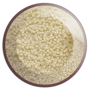 May include: A close-up image of a bowl filled with small, white, round beads. The beads are arranged in a random pattern and appear to be made of glass or plastic.