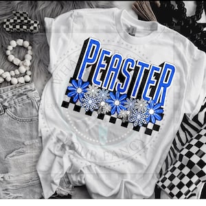 May include: White t-shirt with a blue and black graphic that says "PEASTER" with checkered squares and blue flowers.