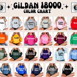 May include: Color chart for Gildan 18000 sweatshirts, showing 18 different colors, including white, ash, sport grey, sand, light pink, red, orange, gold, heliconia, safety pink, maroon, Irish green, military green, forest green, dark chocolate, purple, light blue, Carolina blue, indigo, royal blue, navy blue, dark heather, and black.