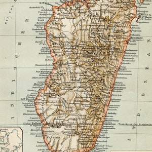 May include: A vintage map of Madagascar, showing the island's geography and political divisions. The map is printed in brown, green, and blue tones, with text labels in German. The map is titled "Madagaskar" and includes a scale bar and a key.