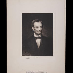 May include: A black and white portrait of Abraham Lincoln, set against a dark background. The image is a lithograph, with the name "Lincoln" printed below the portrait. The print is framed in a white border, with text at the bottom that reads "ENGRAVINGS & LITHOS 2025 ©".