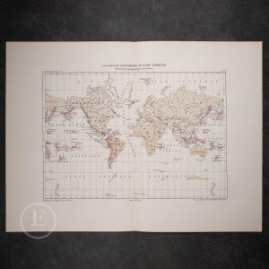 May include: An antique world map titled LA CHALEUR SOUTERRAINE DU GLOBE TERRESTRE, featuring beige continents on a white background with red lines indicating volcanic distribution, grid lines, and black text labels in French.